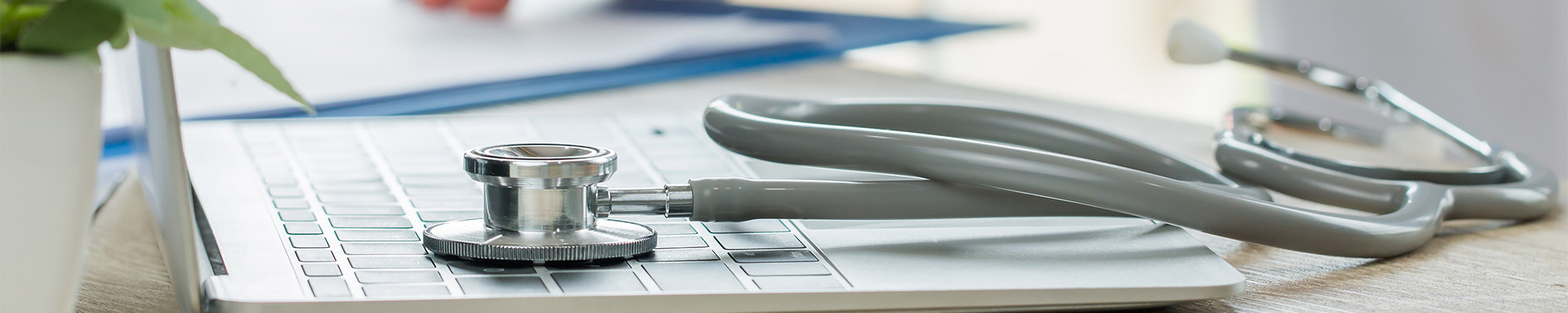 Stethoscope sits on medical laptop sit on desk at Fair Lawn New Jersey Doctors Office 